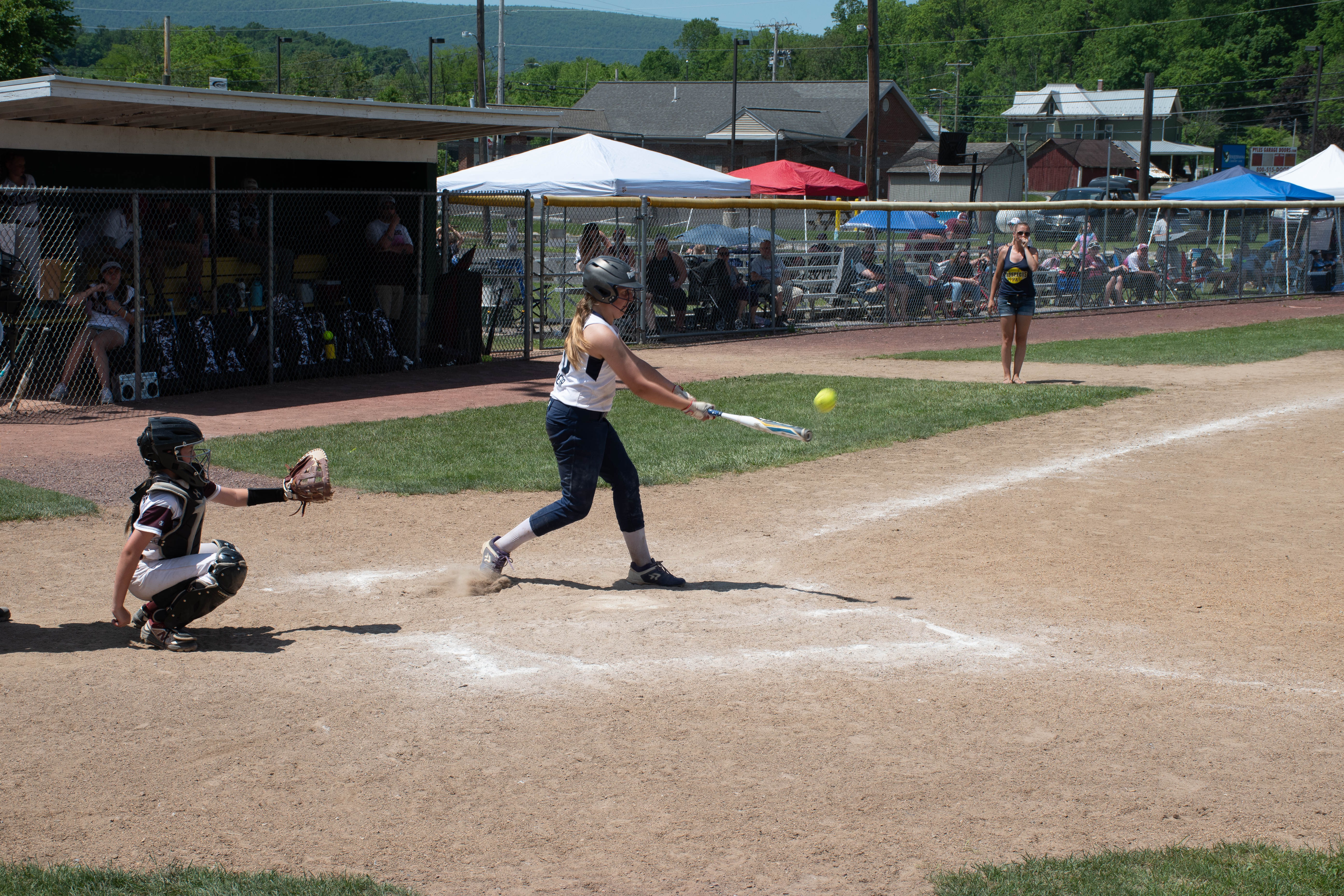 Cathcer and batter just after batter hit the ball.