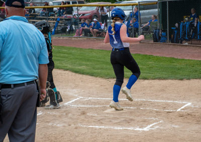 Runner crossing home plate.