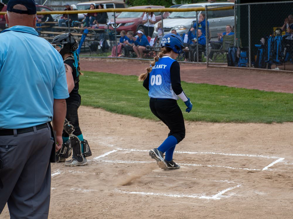 Runner crossing home plate