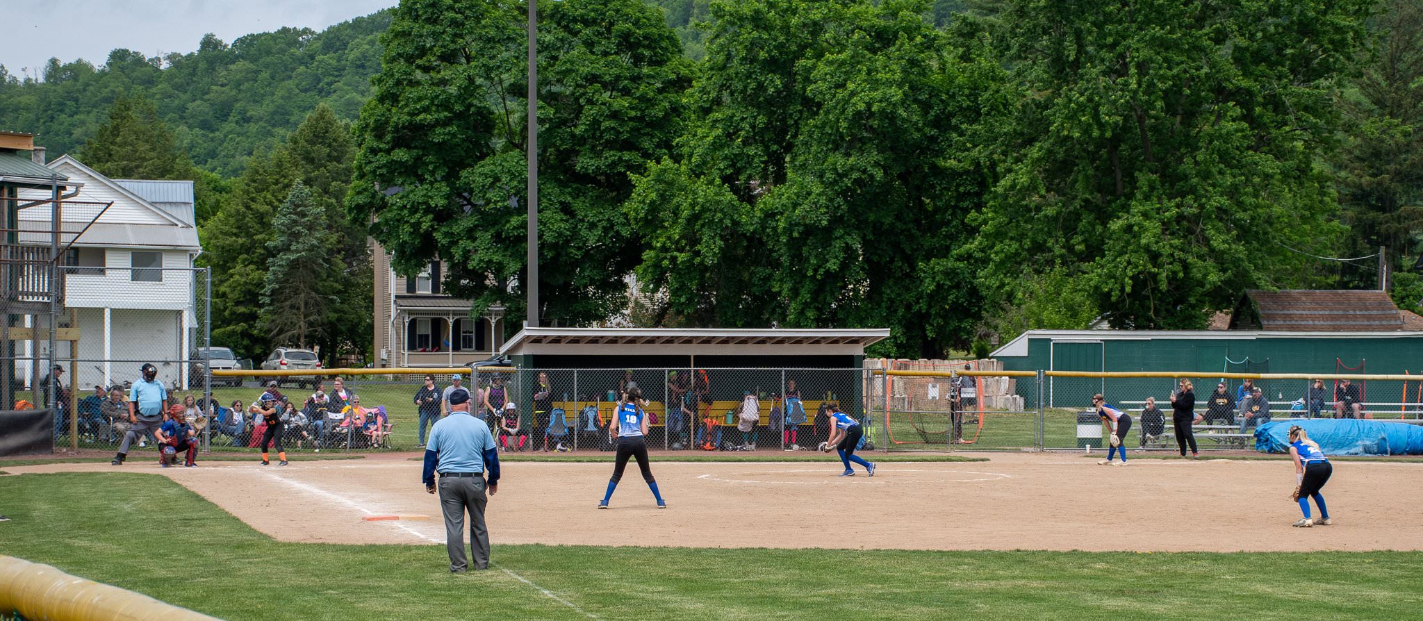 Wide shot of the team in the infield.