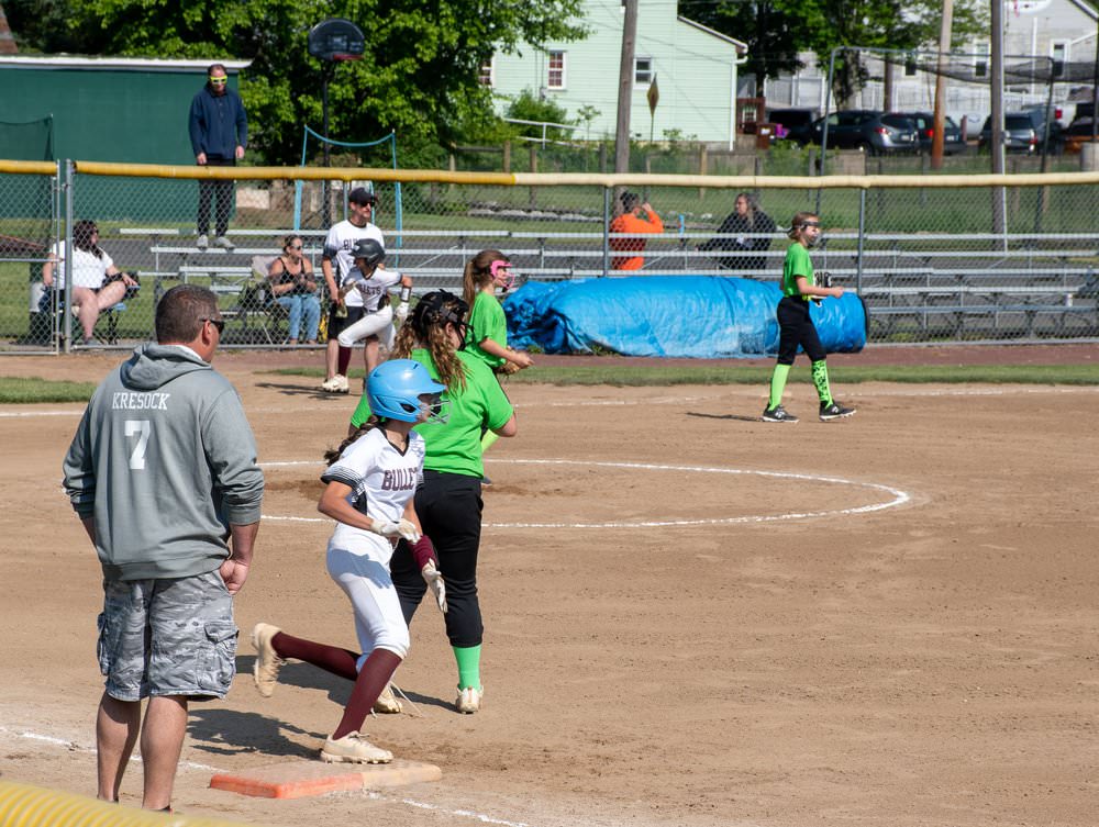 Runner crossing first base.