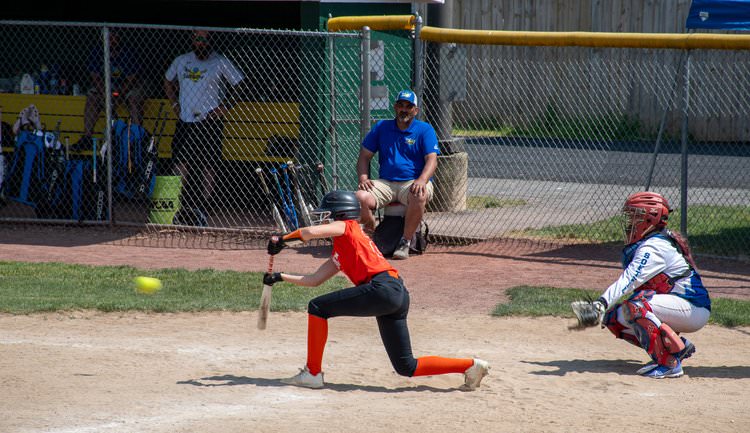 Batter about to bunt ball.