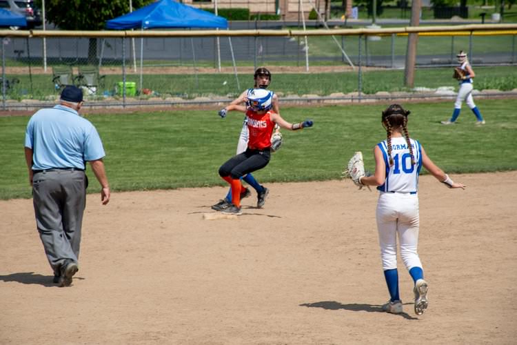 Runner tagging third base.