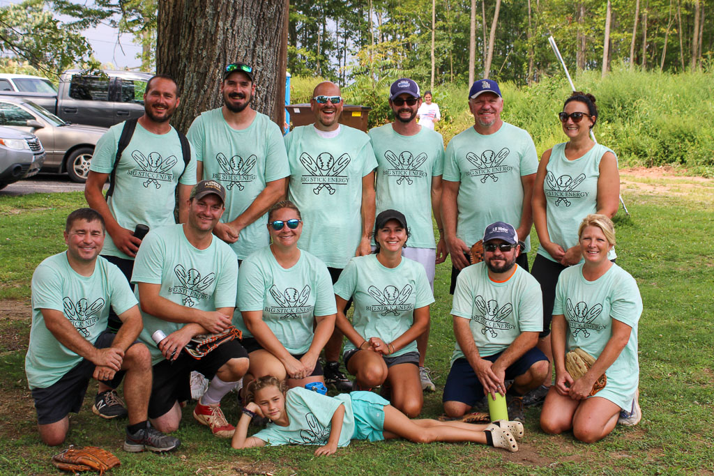 Team Big Stick Energy posing together in front of a tree.