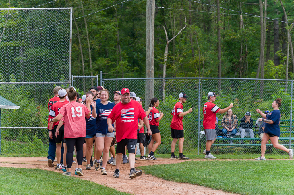 Two teams congratulate each other after the game.