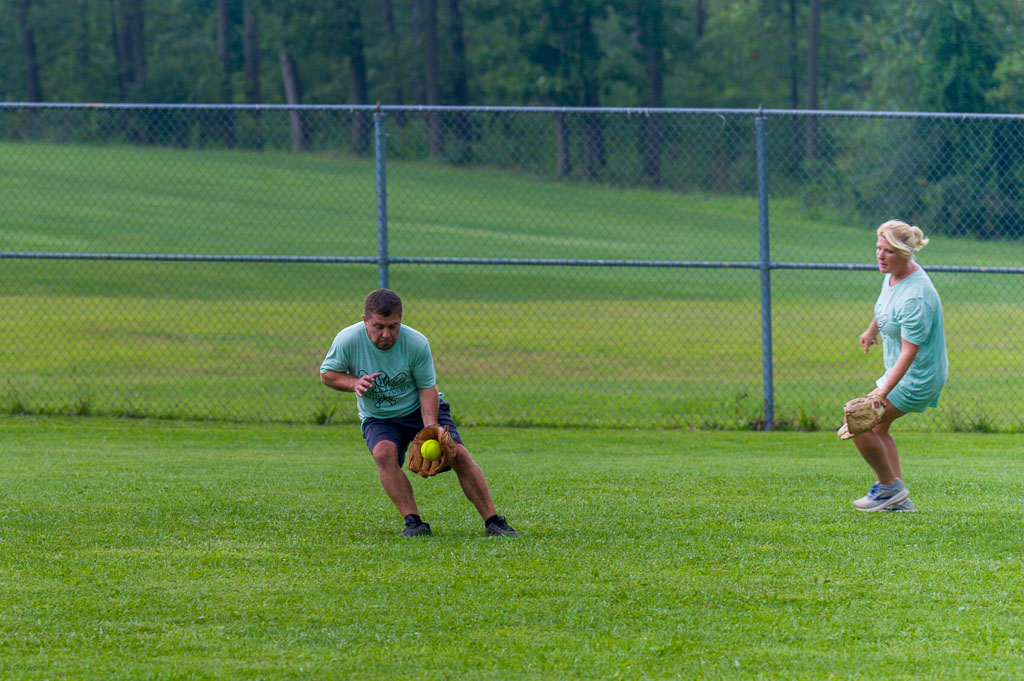 Outfielder catches ground ball.