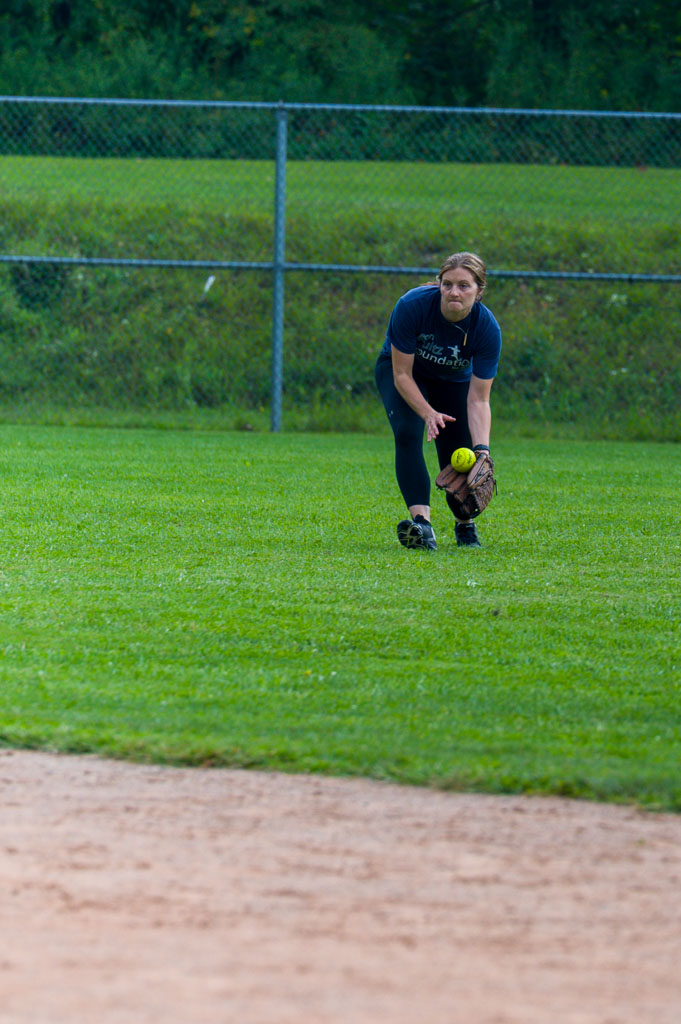 Outfielder catches ground ball.