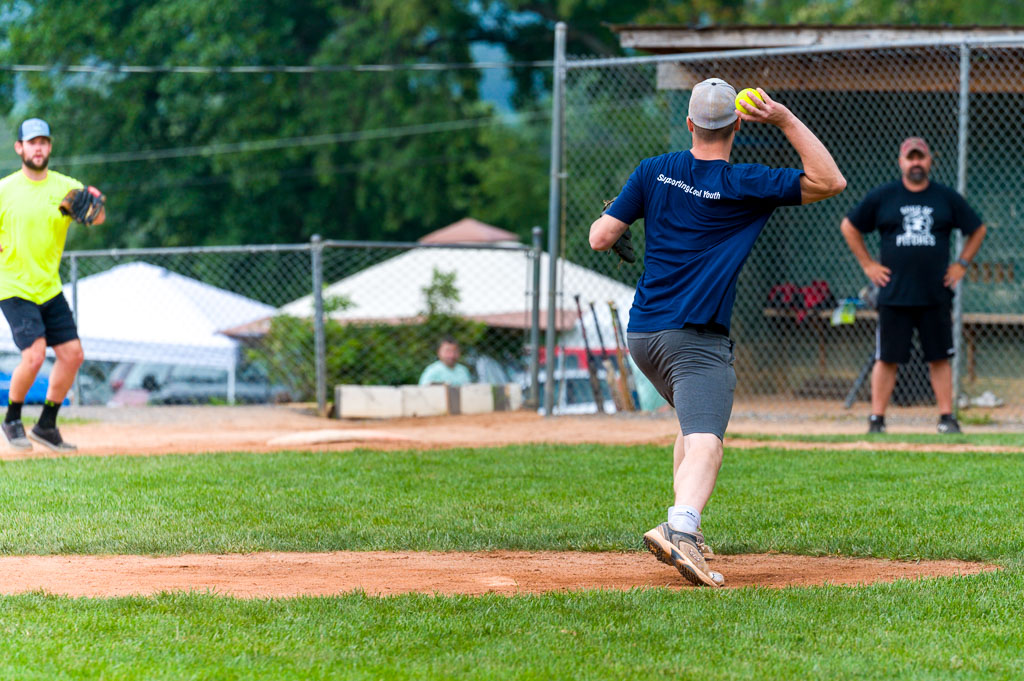 Pitcher is about to throw ball to first baseman.