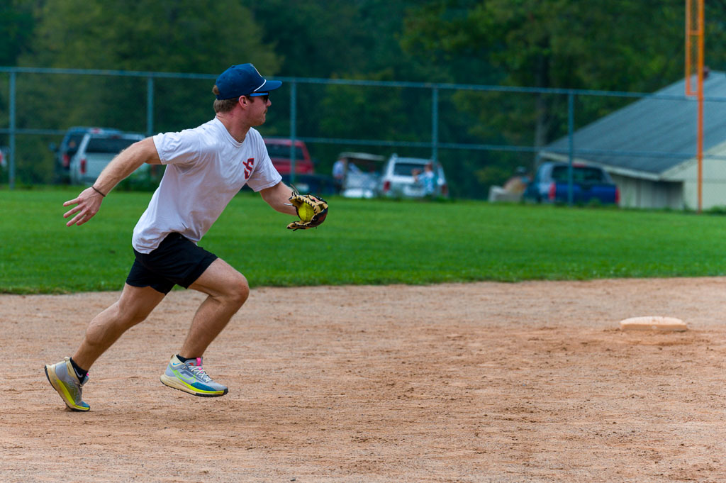 Shortstop with ball runs forward.