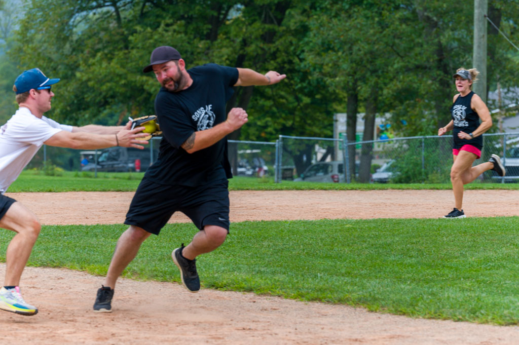 Shortstop with ball tags out runner.