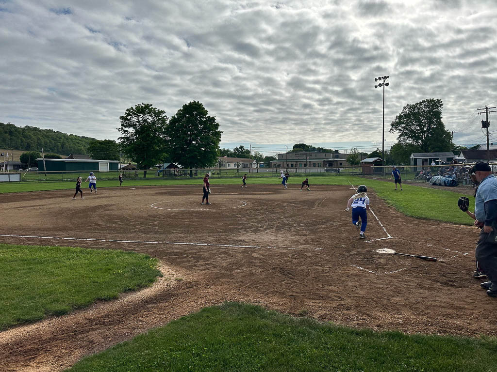 Batter taking off for first base.