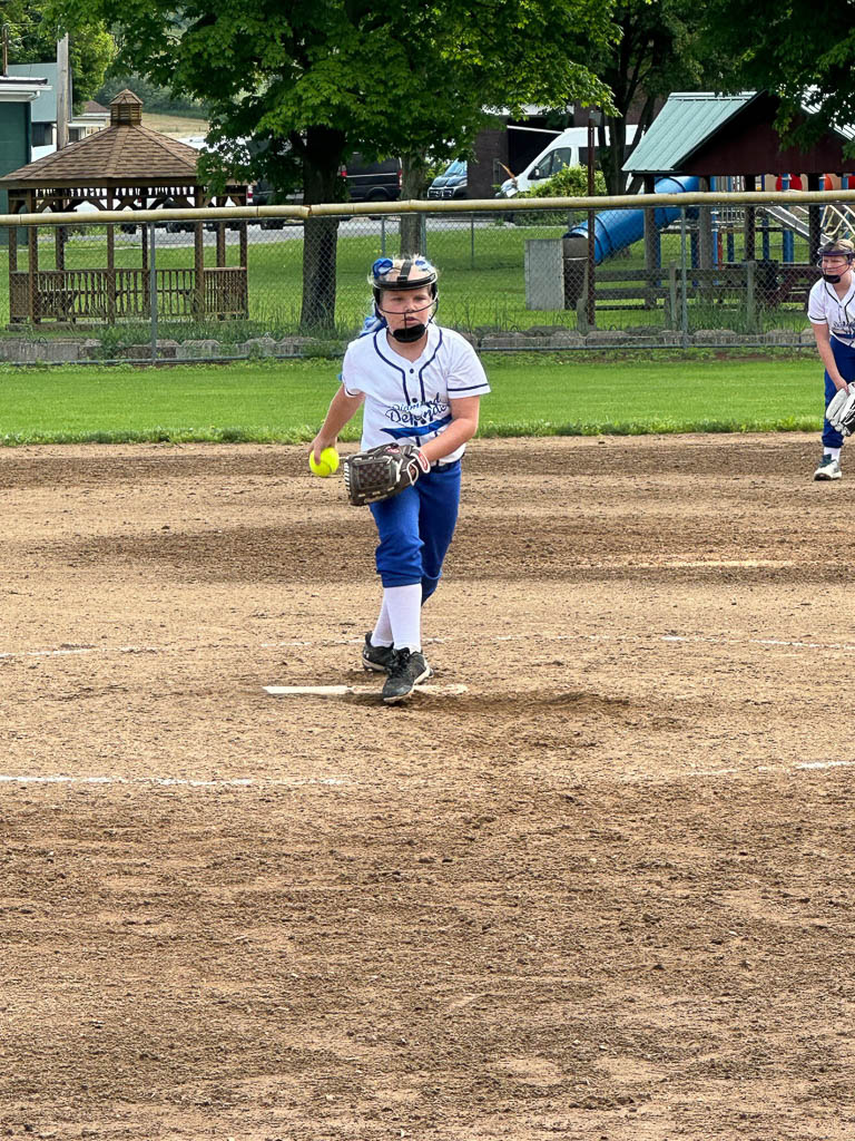 Pitcher in middle of windup.