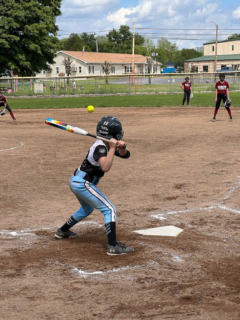 Batter with pitch approaching.