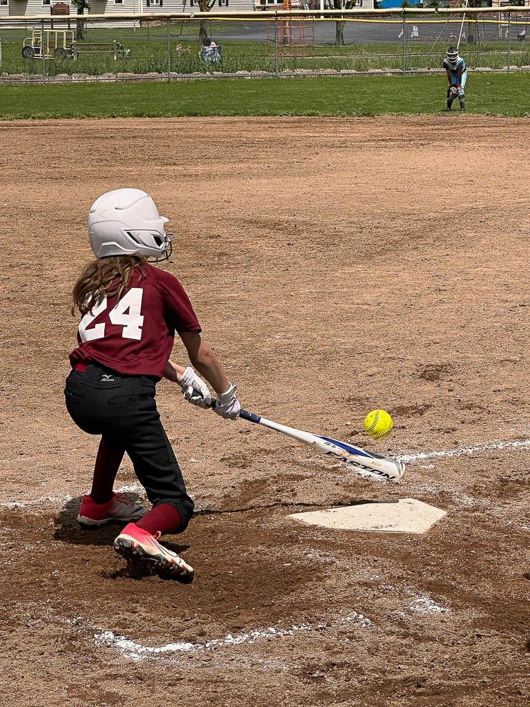 Batter swings at a low ball.