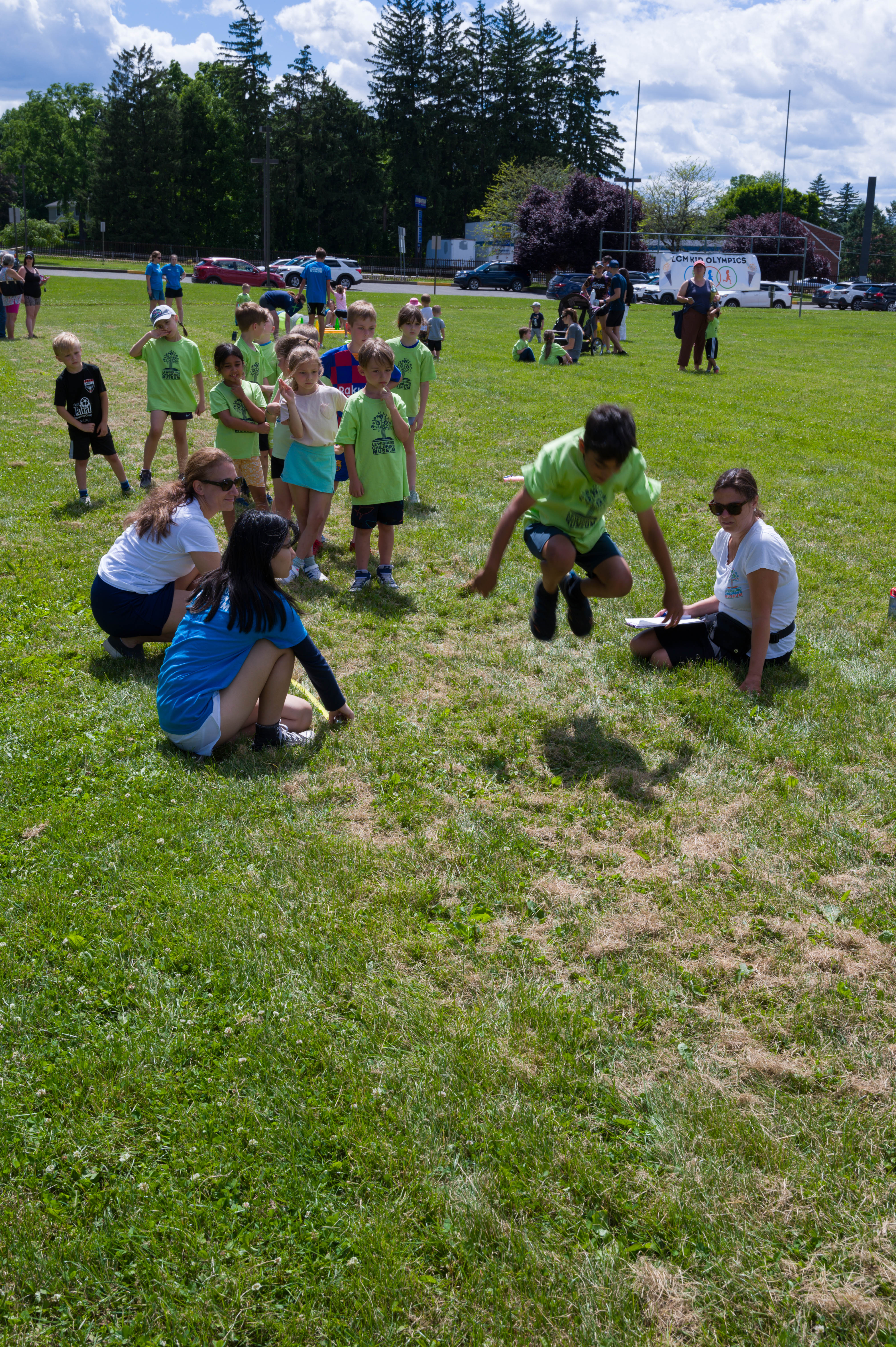 Another boy competes in the long jump.